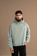 Wear Anarchy Aqua Green Essential Hoodie for men with relaxed fit, long sleeves and embroidered chest logo