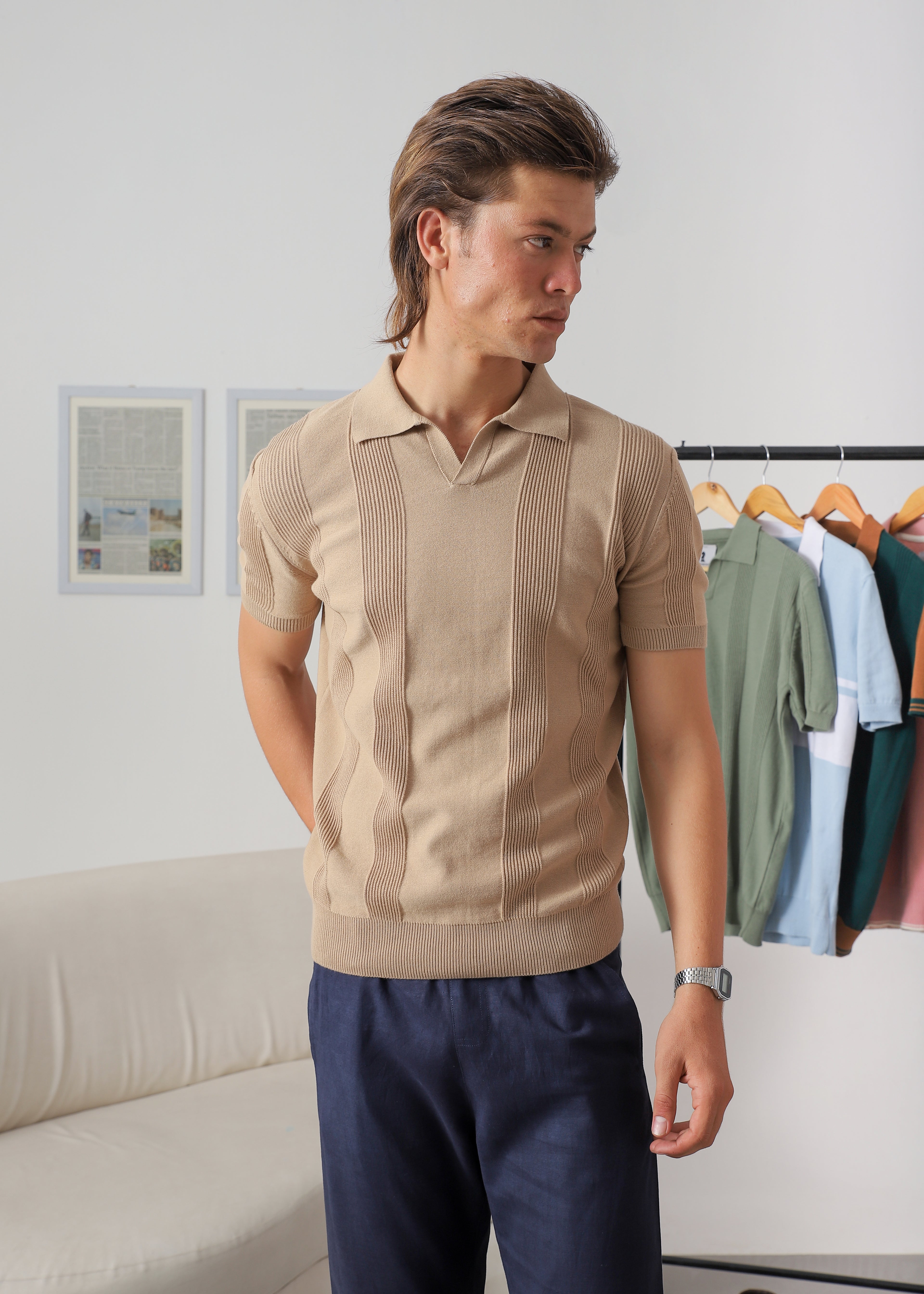 Three-quarter view of Wear Anarchy beige textured knit polo shirt for men with open collar and ribbed hem