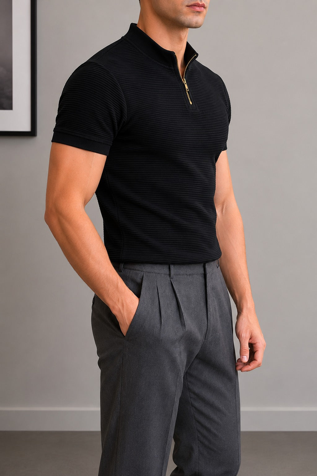Side view of Wear Anarchy black textured quarter-zip polo shirt for men styled with grey trousers