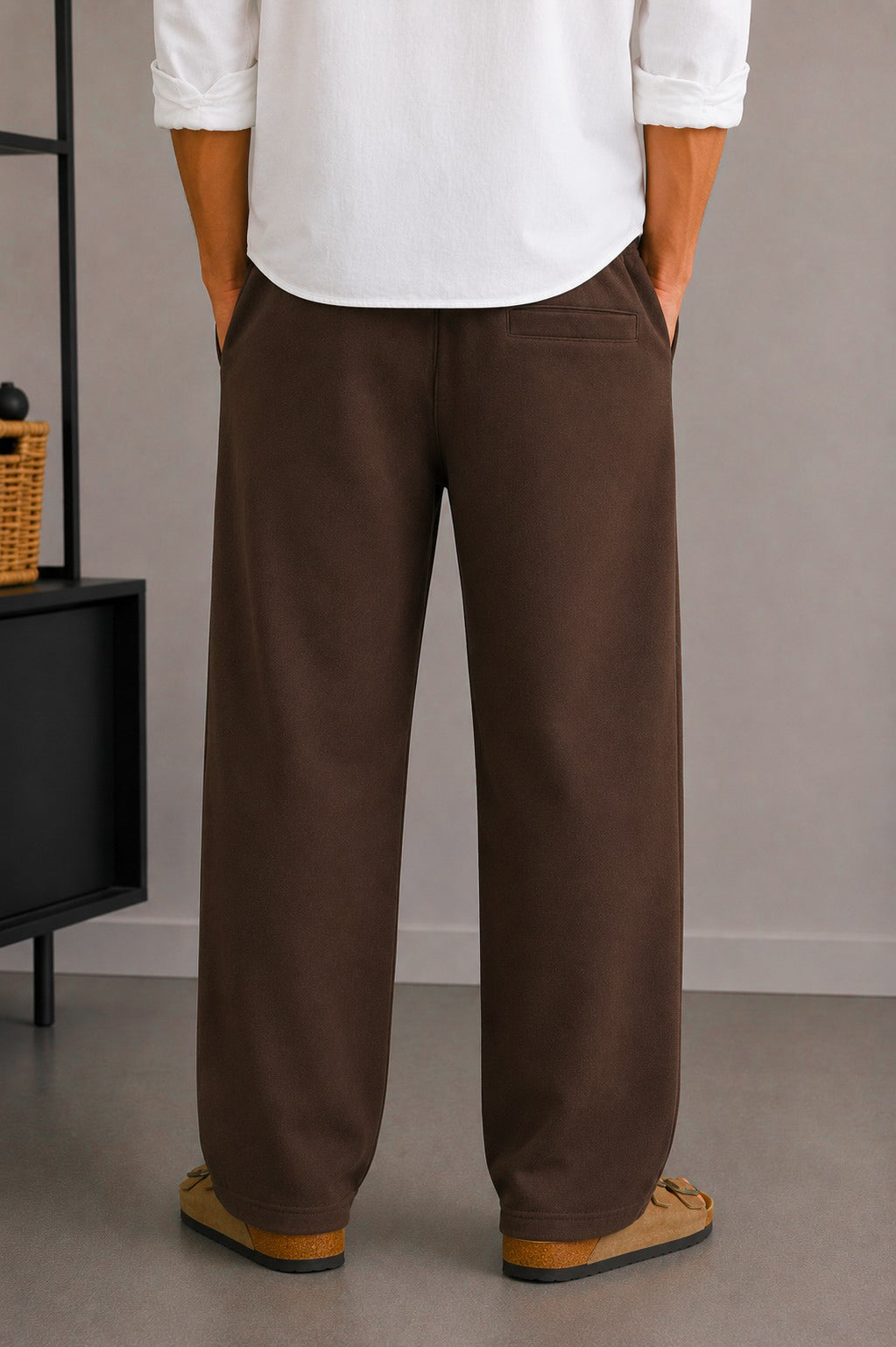 Back view of Wear Anarchy chocolate brown terry trousers for men with relaxed straight-leg fit and rear pocket detail