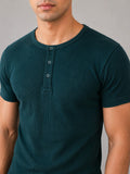 Close-up of Wear Anarchy deep green ribbed Henley shirt for men with short sleeves and three-button placket