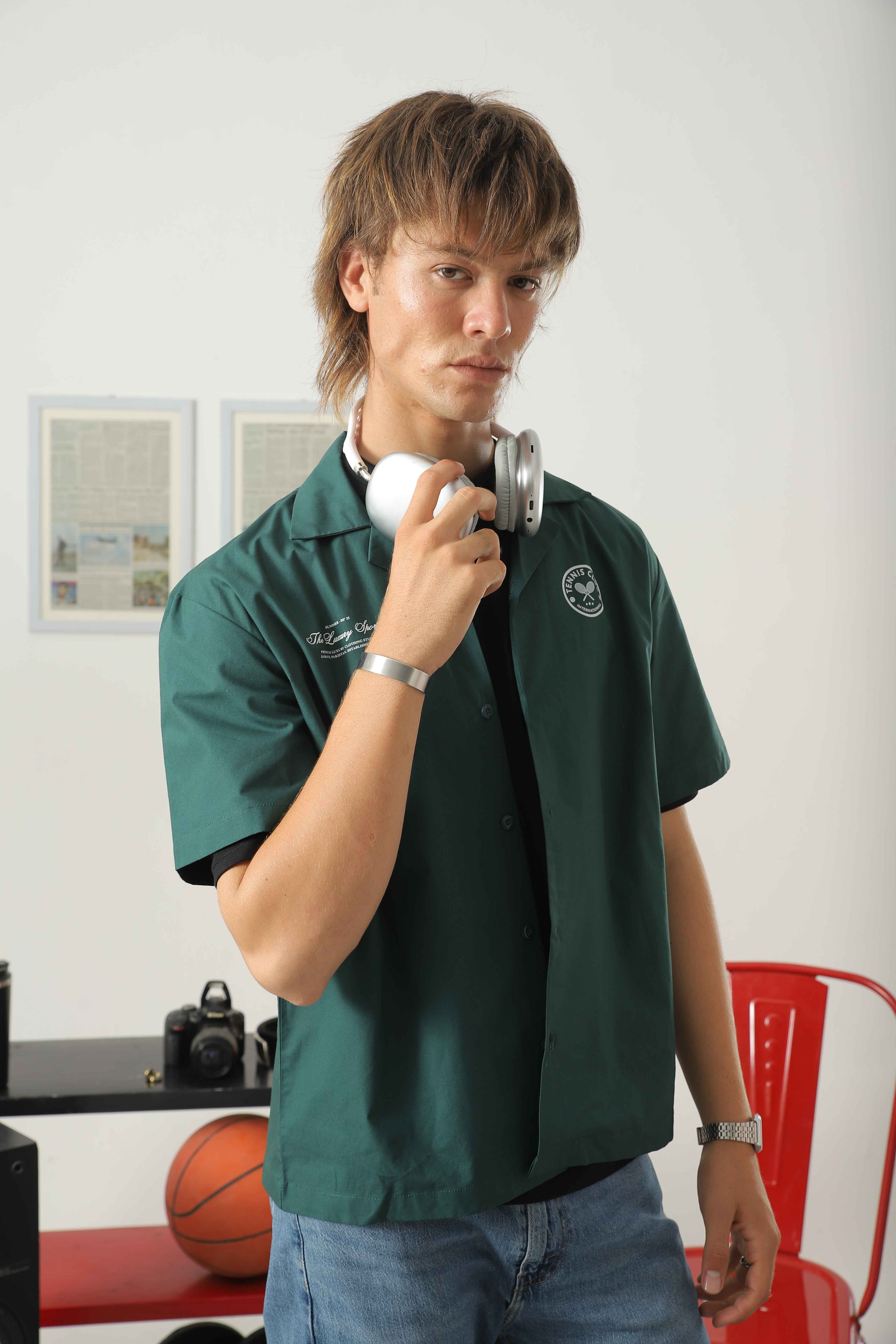 Wear Anarchy green golf resort shirt for men with short sleeves, open collar and embroidered chest details
