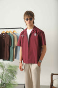 Wear Anarchy maroon golf resort shirt for men with short sleeves, open collar and embroidered chest details