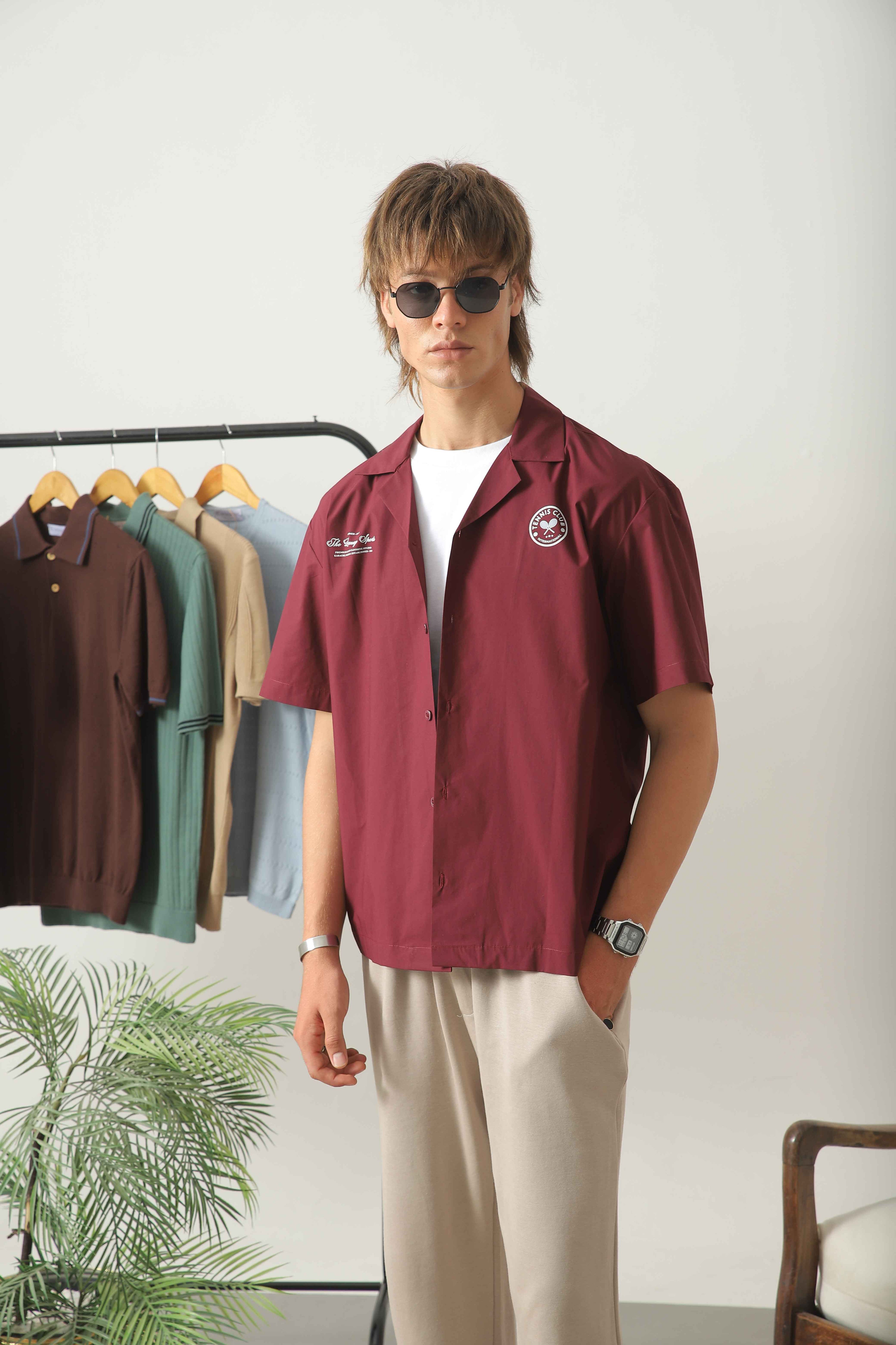 Wear Anarchy maroon golf resort shirt for men with short sleeves, open collar and embroidered chest details