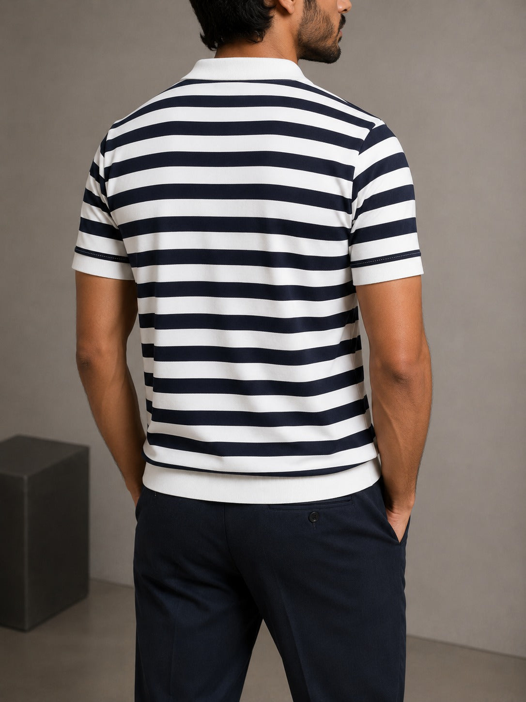 Back view of Wear Anarchy navy and white striped polo shirt for men with short sleeves and ribbed hem
