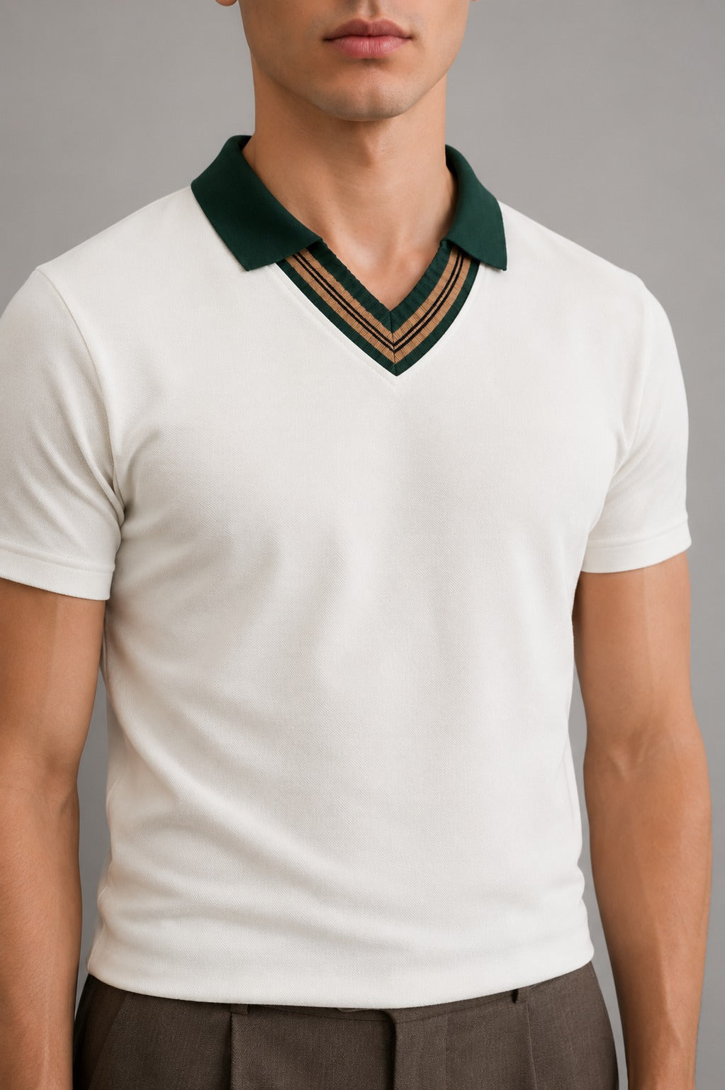 Close-up of Wear Anarchy off-white polo shirt for men with dark green collar and striped V-neck trim