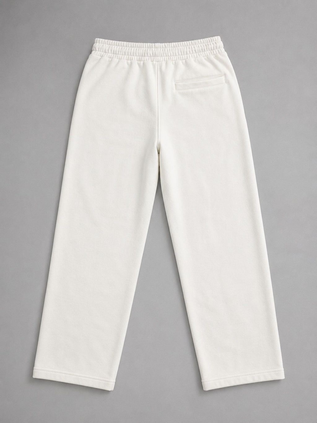 Back view of Wear Anarchy off-white terry trousers for men with a relaxed straight-leg fit and rear pocket