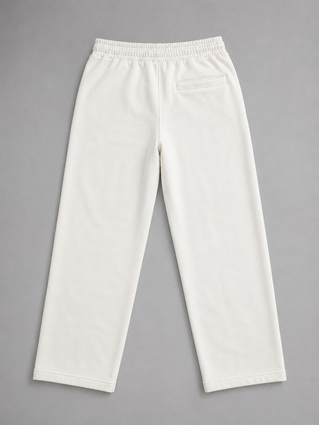 Back view of Wear Anarchy off-white terry trousers for men with a relaxed straight-leg fit and rear pocket