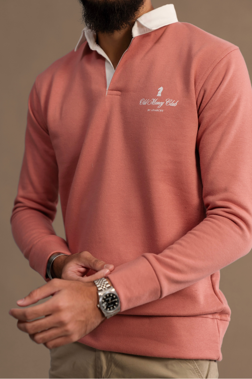Close-up of Wear Anarchy Pink Rugby Sweatshirt for men with white rugby collar and Old Money Club chest embroidery