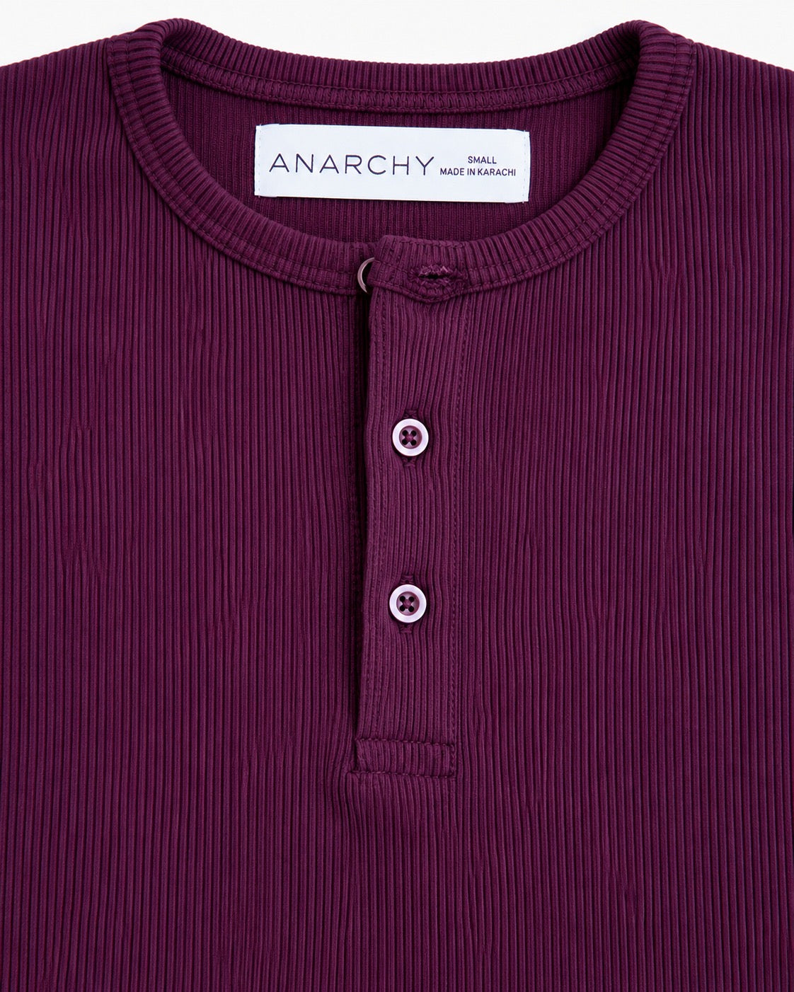 Close-up of Wear Anarchy plum ribbed Henley shirt showing round neck, ribbed texture and button placket