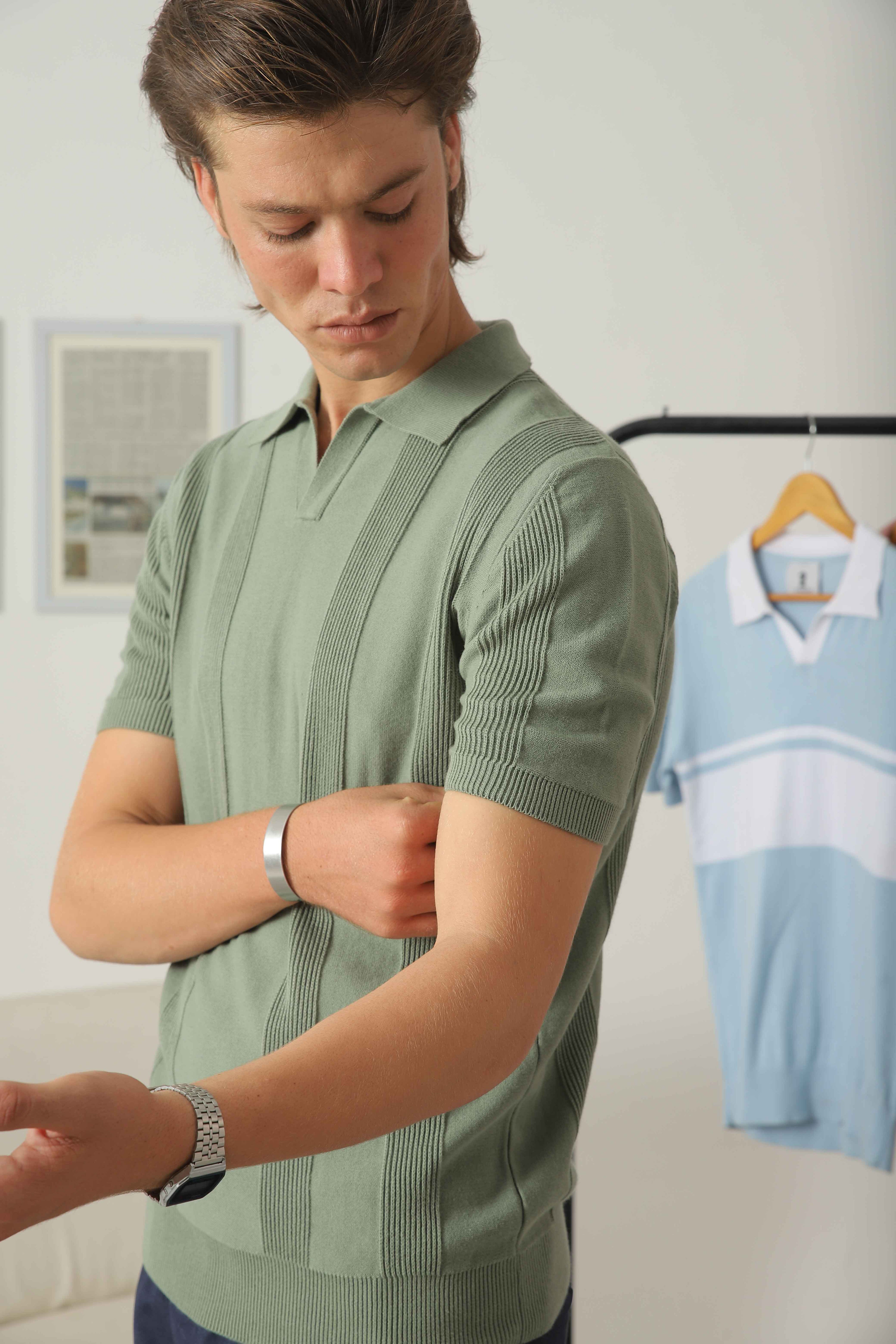 Side detail of Wear Anarchy sage green textured knit polo shirt for men showing short sleeve and vertical knit pattern