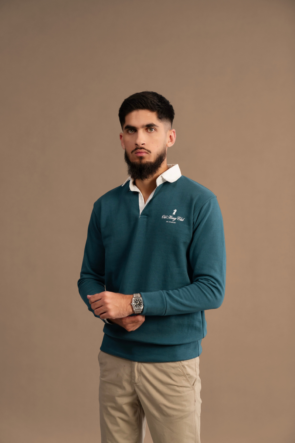 Front pose of Wear Anarchy Teal Rugby Sweatshirt for men with white rugby collar and embroidered chest logo