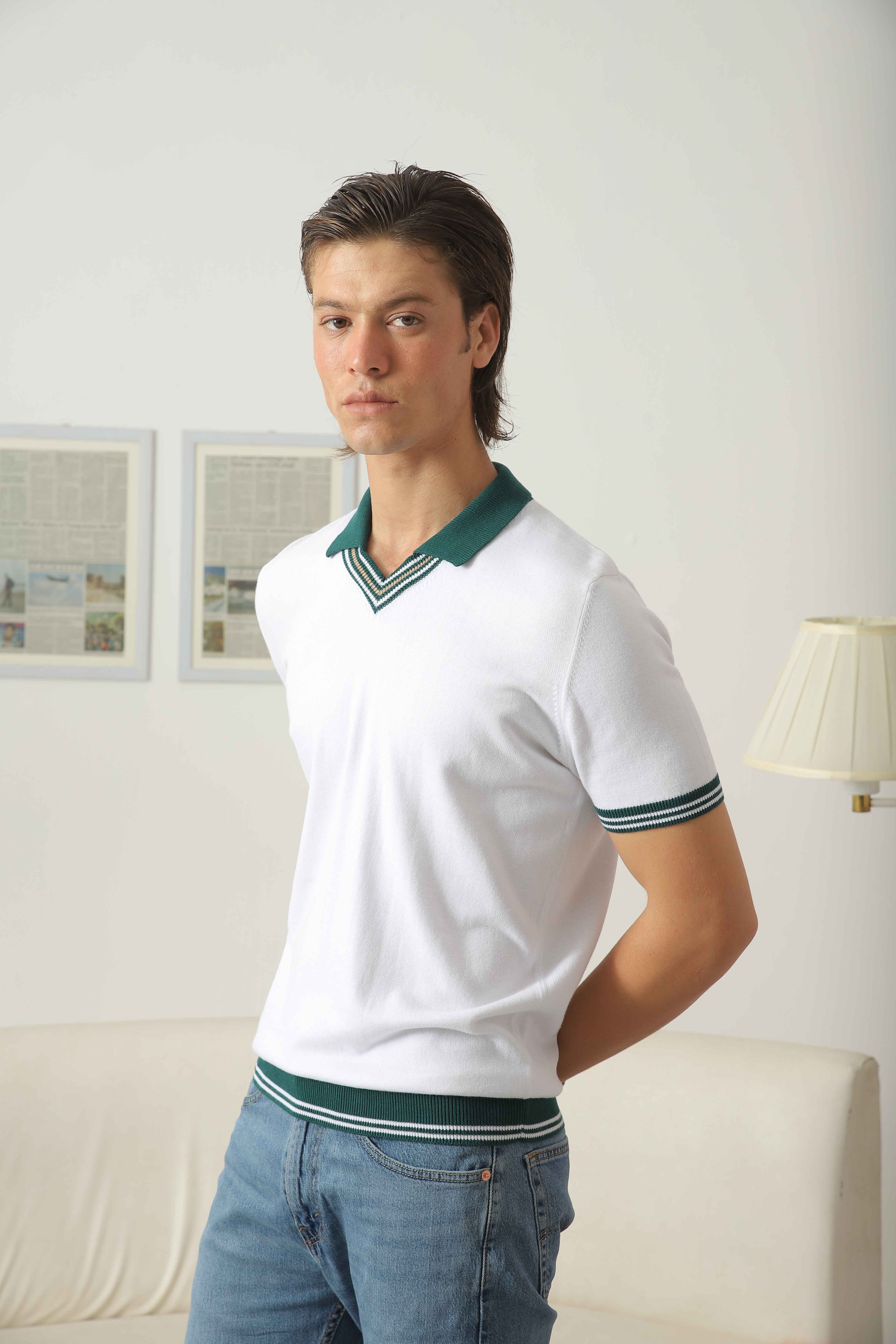 Side view of Wear Anarchy white knit polo shirt for men with green contrast collar, striped V-neck trim and sleeve detailing