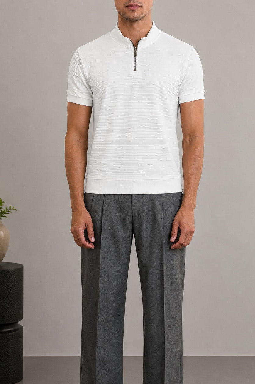 Front view of Wear Anarchy white textured quarter-zip polo shirt for men styled with grey trousers